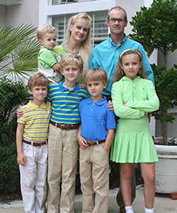 Jim Popp and his wife pictured with their five children