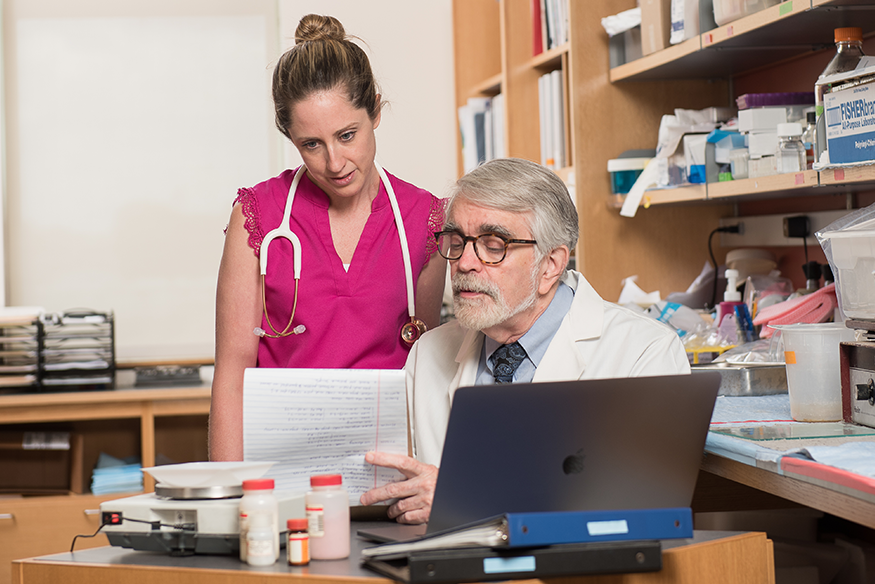 Steven Grant, M.D., and Keri Maher, D.O. pictured in the laboratory