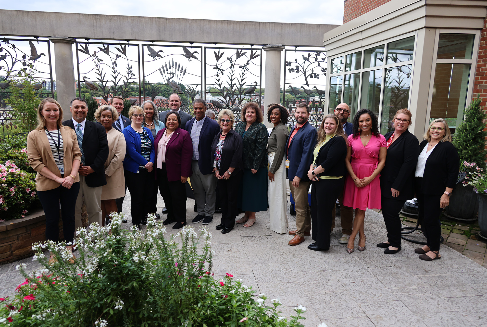 Leadership from DMAS and Massey pose for a post meeting picture.